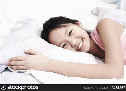 Portrait of a girl lying on the bed