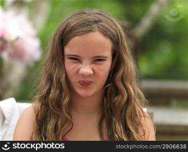 Portrait of a girl making funny face, Lake of the Woods, Ontario, Canada