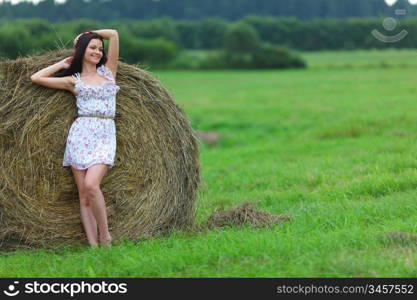 portrait of a girl next to haystack