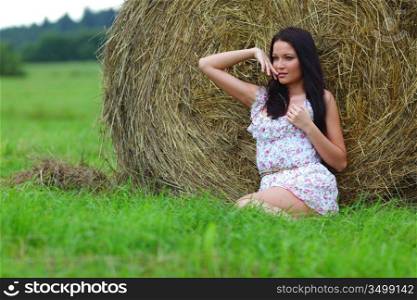 portrait of a girl next to haystack