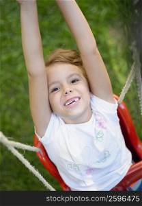 Portrait of a girl on a swing