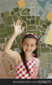 Portrait of a girl raising her hand