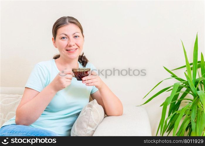 portrait of a girl relaxing with a cup of tea