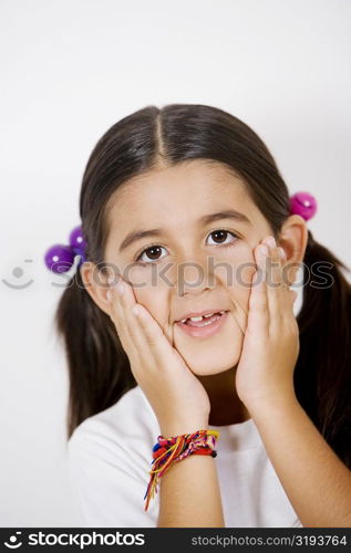 Portrait of a girl rubbing her face