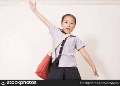 Portrait of a girl shouting with her hand raised