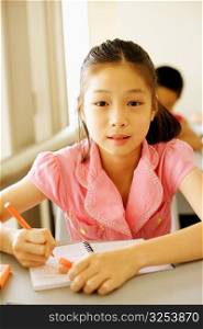 Portrait of a girl sitting in the classroom