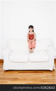 Portrait of a girl sitting on a couch