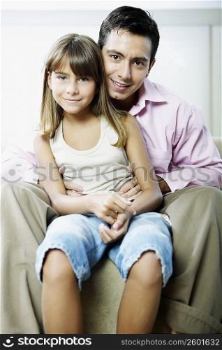 Portrait of a girl sitting with her father
