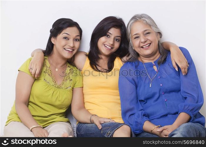 Portrait of a girl sitting with her mother and grandmother