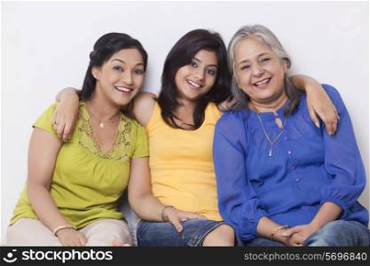 Portrait of a girl sitting with her mother and grandmother