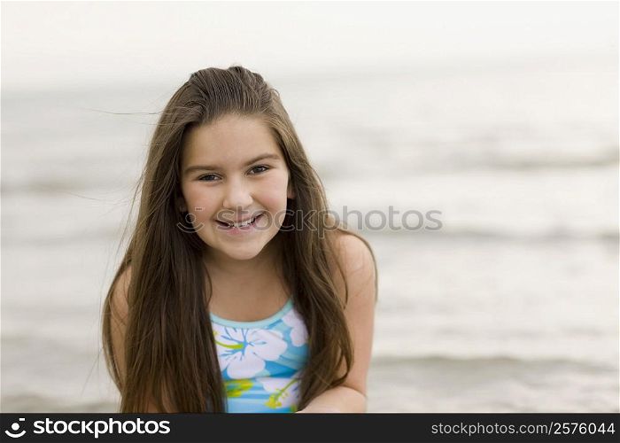 Portrait of a girl smiling on the beach