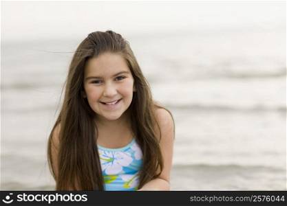 Portrait of a girl smiling on the beach