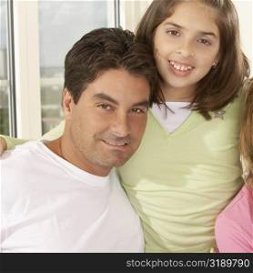 Portrait of a girl smiling with her father