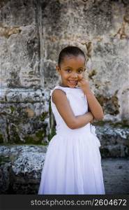 Portrait of a girl smiling with her hand on her chin, Santo Domingo, Dominican Republic