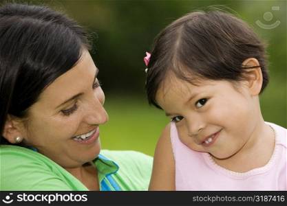 Portrait of a girl smiling with her mother
