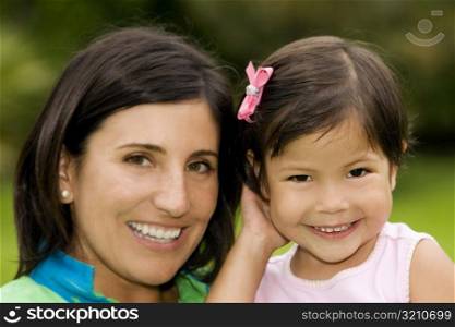 Portrait of a girl smiling with her mother