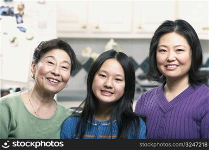 Portrait of a girl smiling with her mother and grandmother
