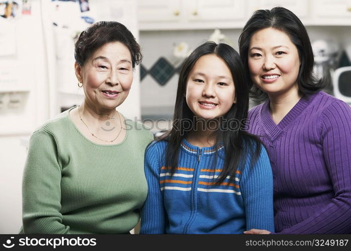 Portrait of a girl smiling with her mother and grandmother