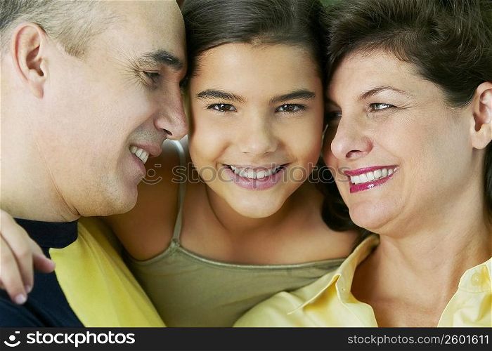 Portrait of a girl smiling with her parents