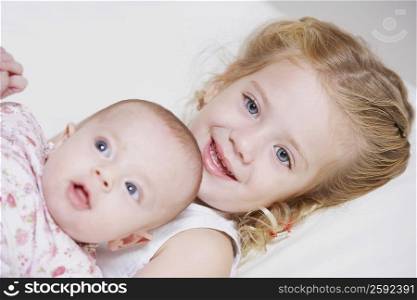 Portrait of a girl smiling with her sister