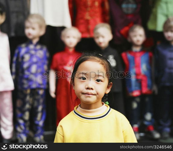 Portrait of a girl standing in a clothing store