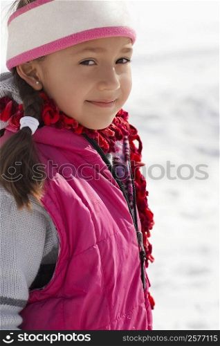 Portrait of a girl standing in snow