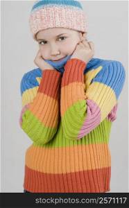 Portrait of a girl standing with holding her sweater