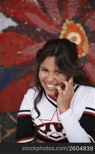 Portrait of a girl talking on a mobile phone and smiling