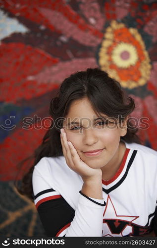 Portrait of a girl thinking with her hand on her chin