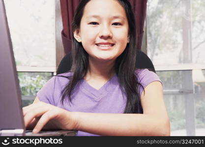 Portrait of a girl using a laptop