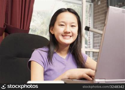 Portrait of a girl using a laptop