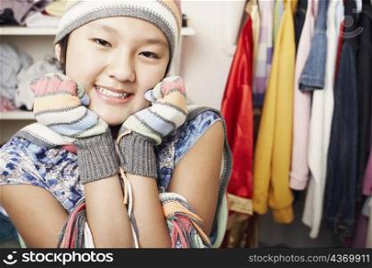 Portrait of a girl wearing a hat and gloves