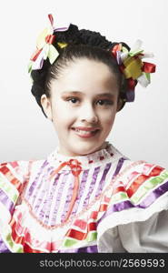 Portrait of a girl wearing traditional clothing and smiling