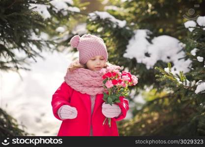 Portrait of a girl with a bouquet of pink carnations.. A little girl carries a bouquet for mom 926.. A little girl carries a bouquet for mom 926.
