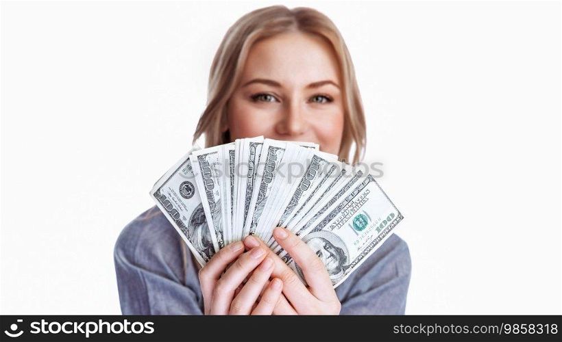Portrait of a girl with a dollars fan isolated on a white background. Businesswoman after a successful transaction. Conceptual photo of making money.. Conceptual Photo of Making Money