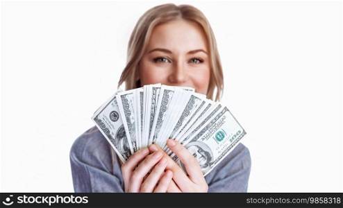 Portrait of a girl with a dollars fan isolated on a white background. Businesswoman after a successful transaction. Conceptual photo of making money.. Conceptual Photo of Making Money