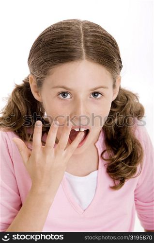 Portrait of a girl with her finger in her mouth