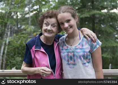 Portrait of a girl with her grandmother smiling, Lake of The Woods, Unorganized Kenora, Kenora, Lake of The Woods, Ontario, Canada