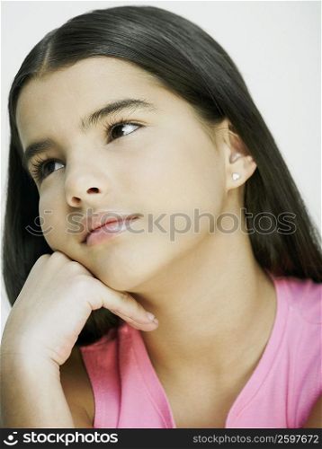Portrait of a girl with her hand on her chin