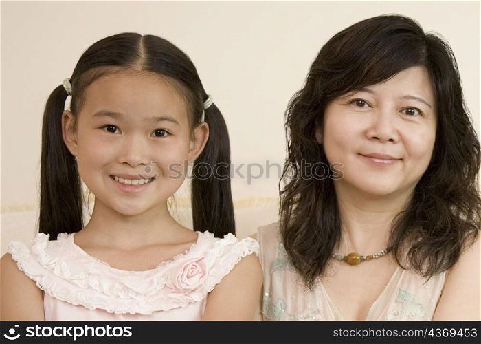Portrait of a girl with her mother smiling