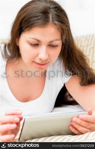 portrait of a girl with tablet computer in hands