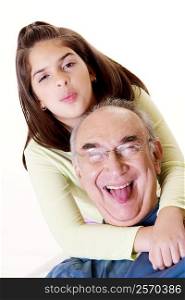 Portrait of a granddaughter hugging her grandfather