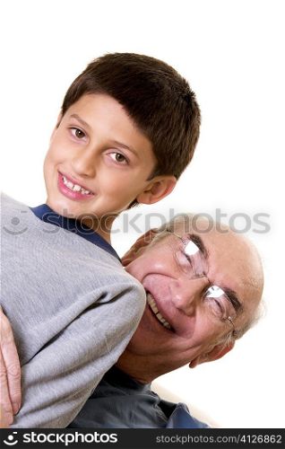 Portrait of a grandfather hugging his grandson