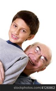 Portrait of a grandfather hugging his grandson