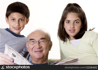 Portrait of a grandfather with his grandson and his granddaughter