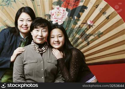Portrait of a grandmother with her daughter and granddaughter