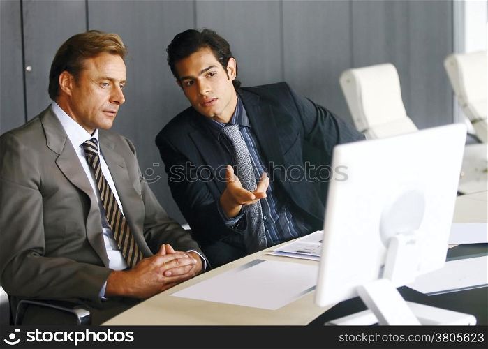 Portrait of a group of business men working together at a meeting