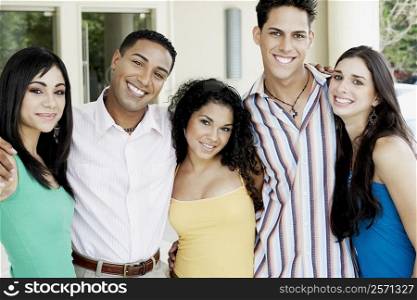 Portrait of a group of friends standing side by side and smiling