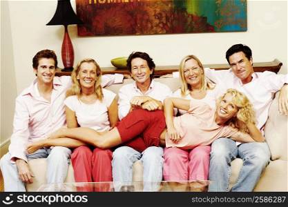 Portrait of a group of people sitting together on a couch