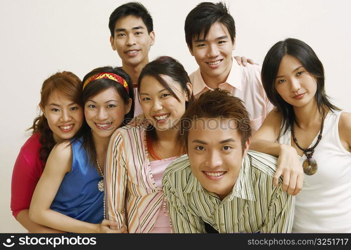 Portrait of a group of people standing together and smiling